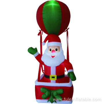 Happy holiday inflatable santa in hot air balloon